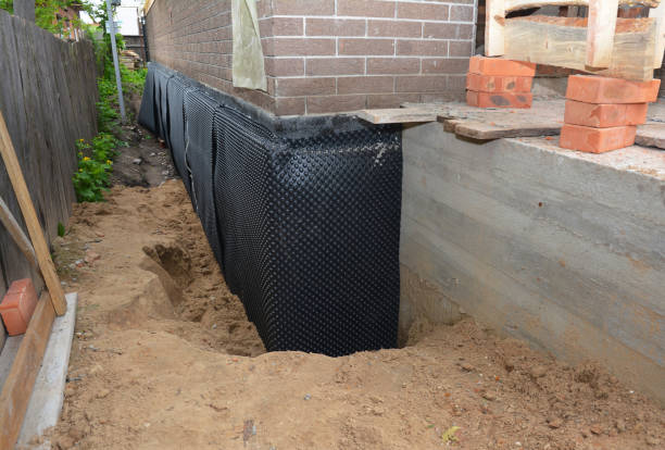 Happy homeowners after waterproofing job in New Holland